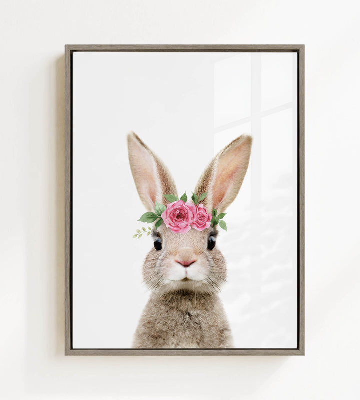 A picture of a rabbit wearing a flower crown on its head.