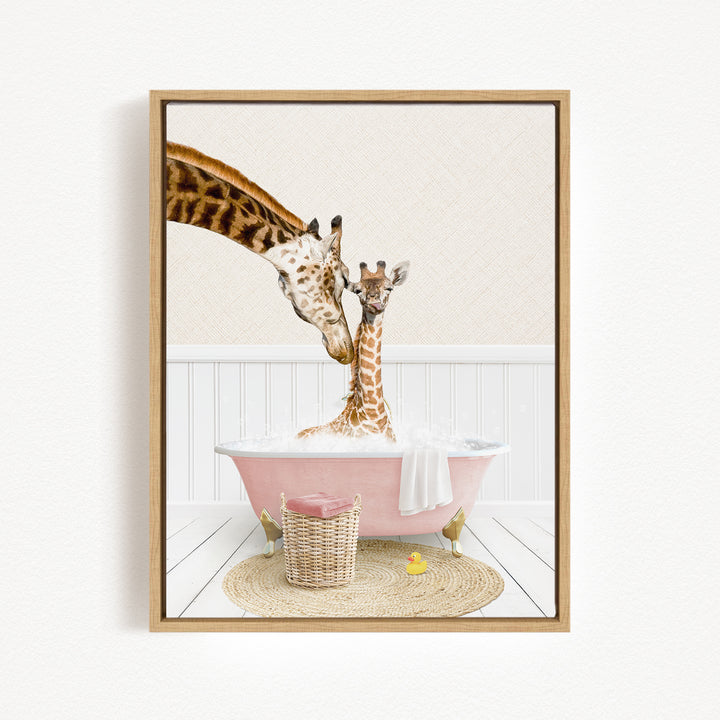 A mother giraffe and her baby giraffe enjoying a bath together in a pink bathtub, with a basket of toys nearby.