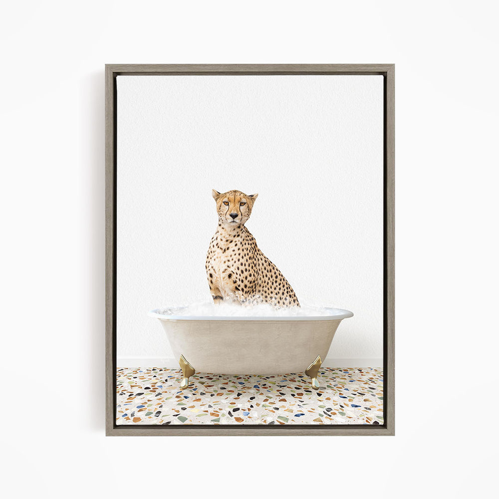 A cheetah sitting in a bathtub filled with water, looking directly at the camera.