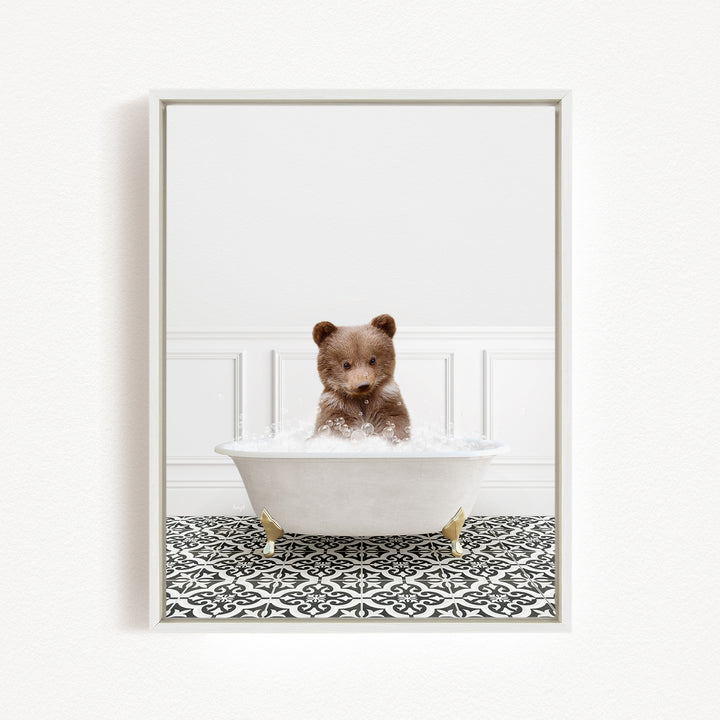 A brown bear sitting in a white bathtub filled with water, surrounded by a black and white patterned floor.