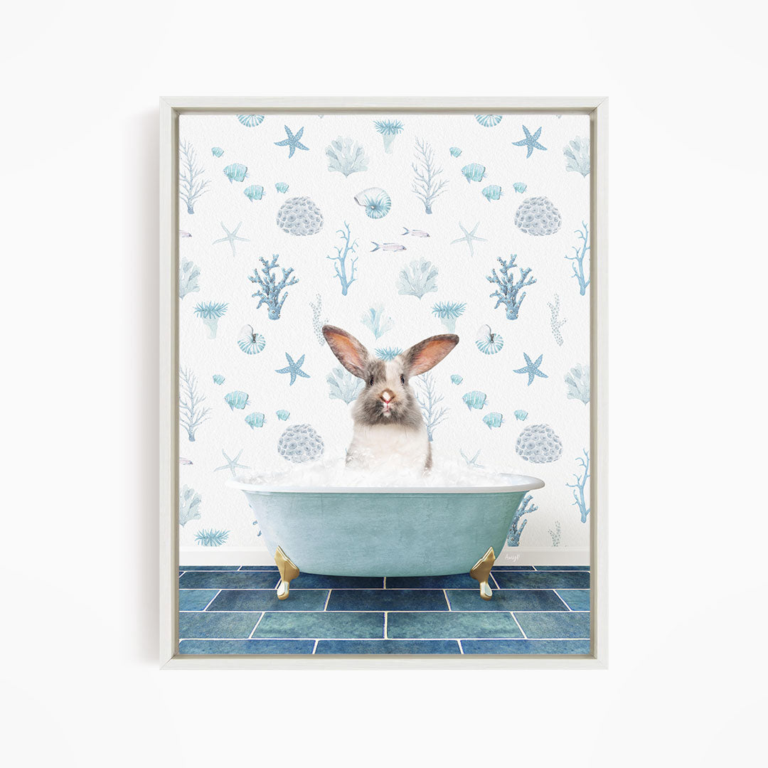 A white rabbit sitting in a blue bathtub filled with bubbles, surrounded by a pattern of seashells, starfish, and other marine life.