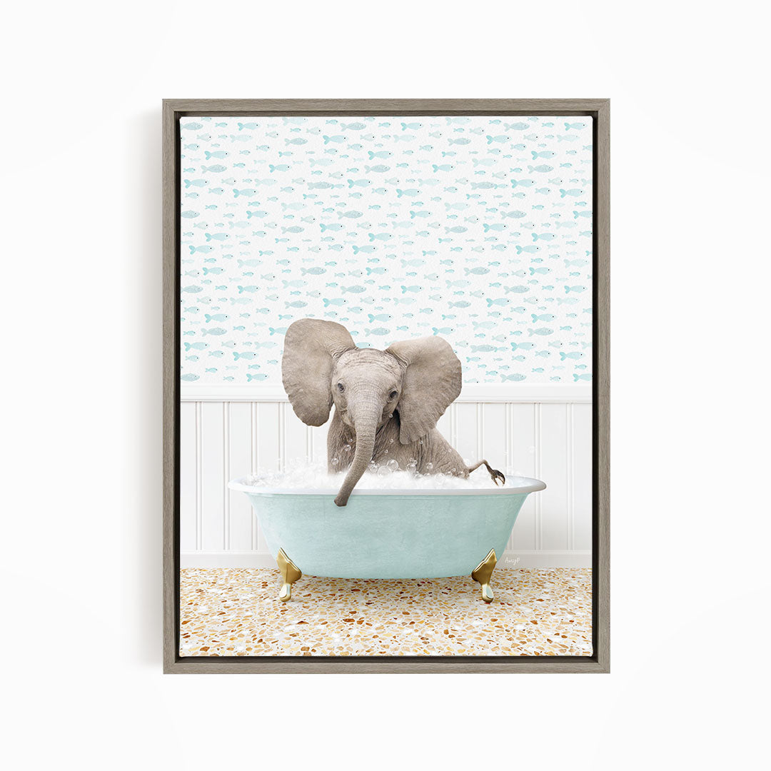 A baby elephant sitting in a blue bathtub filled with water, surrounded by a pattern of fish.