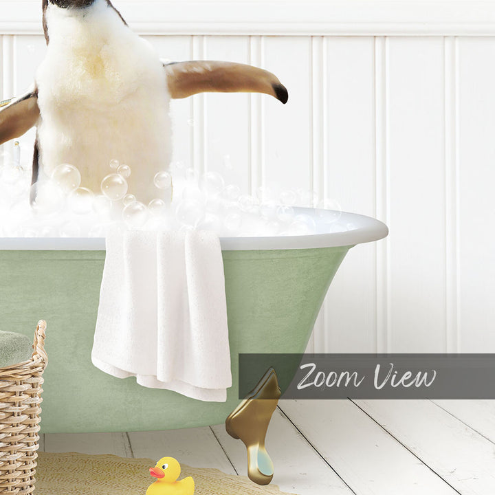 A penguin standing in a bathtub filled with bubbles, surrounded by a yellow rubber duck and a towel.