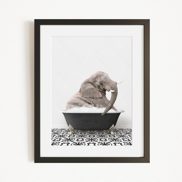 A gray elephant sitting in a black bathtub filled with water, surrounded by a black and white patterned floor.