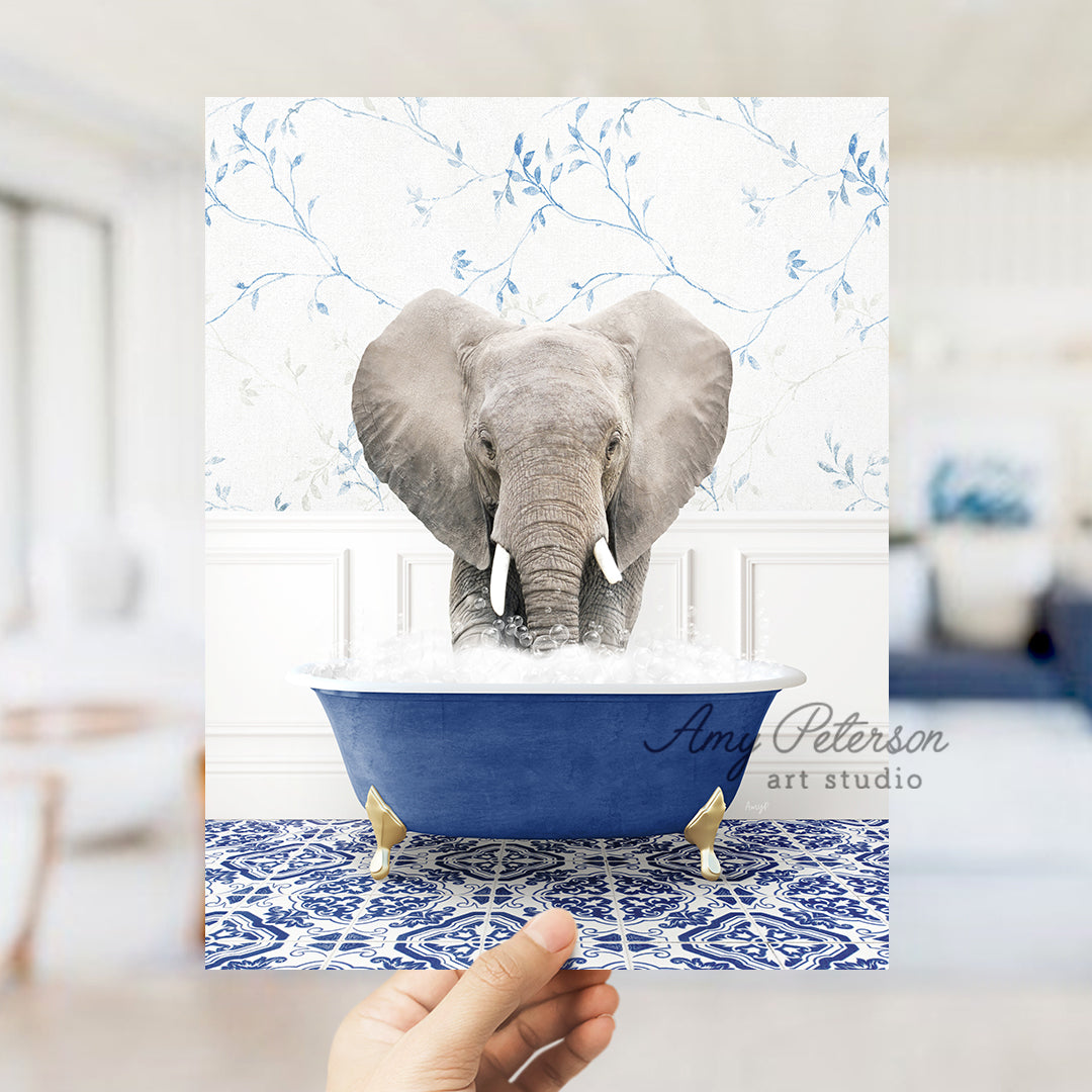 a person holding up a card with a picture of an elephant in a bathtub