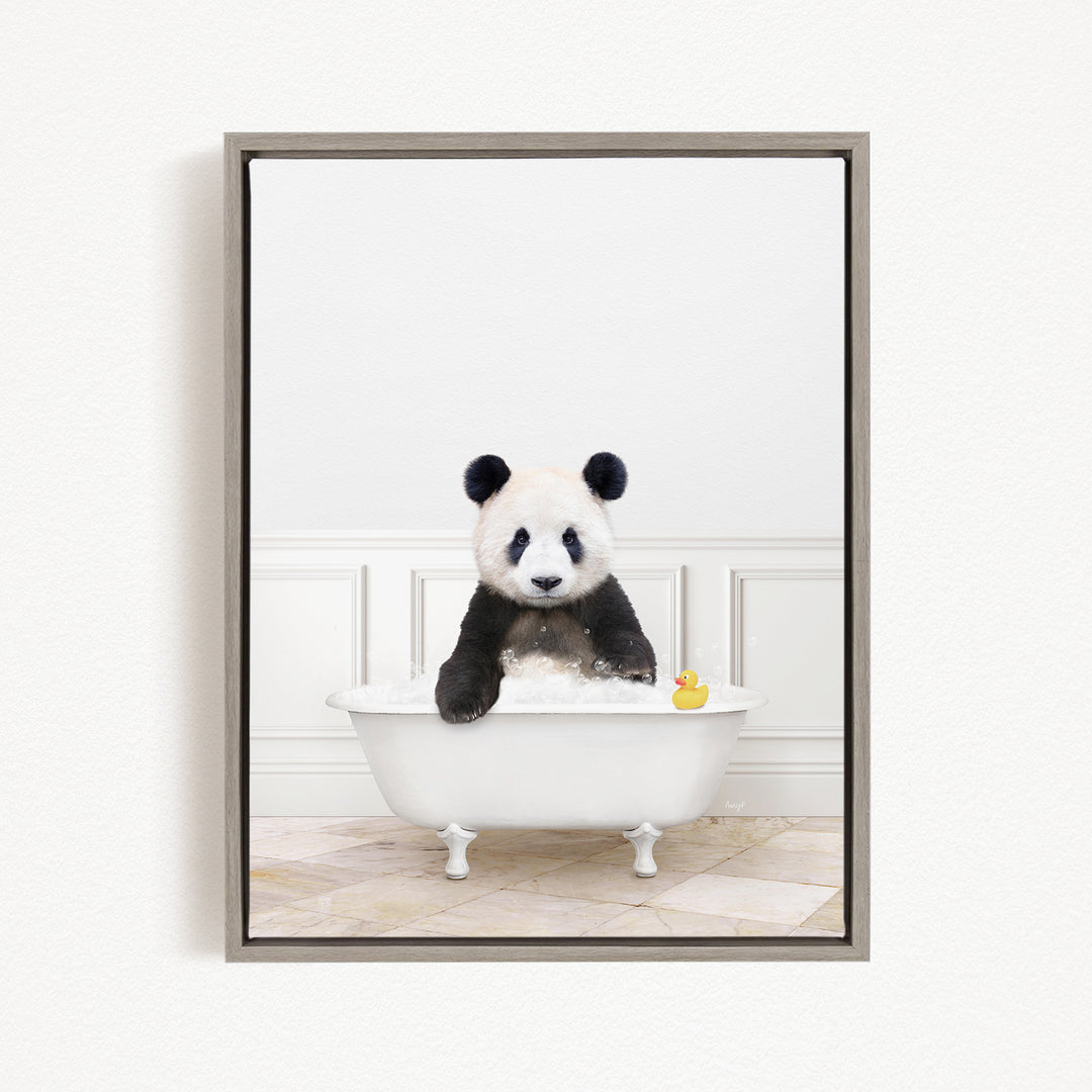 A panda bear sitting in a white bathtub, surrounded by a yellow rubber duck.