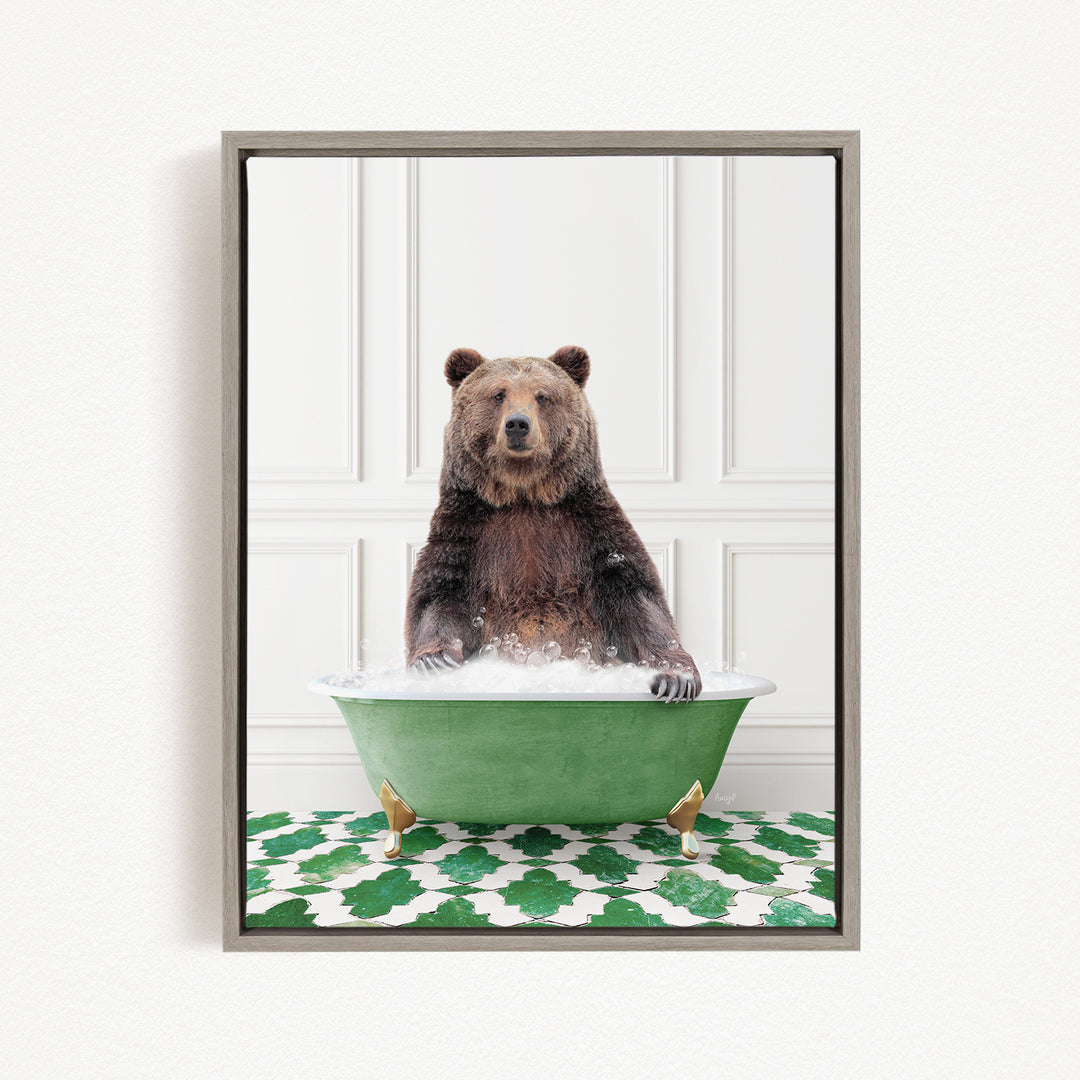 A brown bear sitting in a green bathtub filled with water, surrounded by a green and white patterned rug.