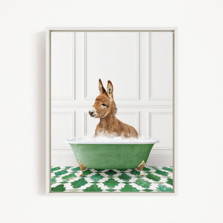 A donkey is sitting in a green bathtub filled with water, surrounded by a patterned green and white floor.