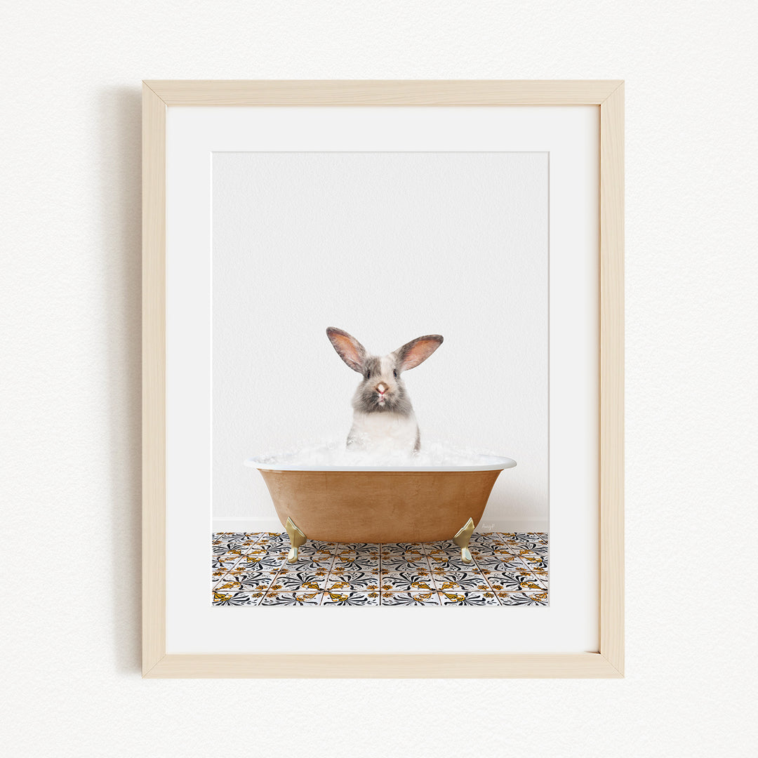 A white rabbit sitting in a brown bathtub filled with water, with a patterned tile floor beneath it.