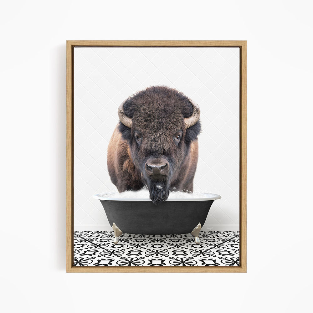 A buffalo with large horns is standing in a bathtub filled with water, creating a playful and whimsical scene.