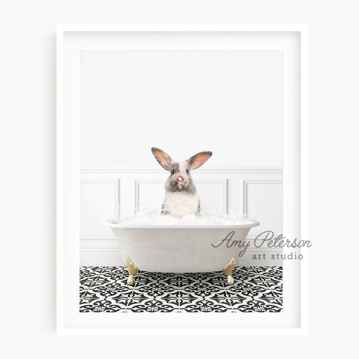 a rabbit is sitting in a bathtub with foam