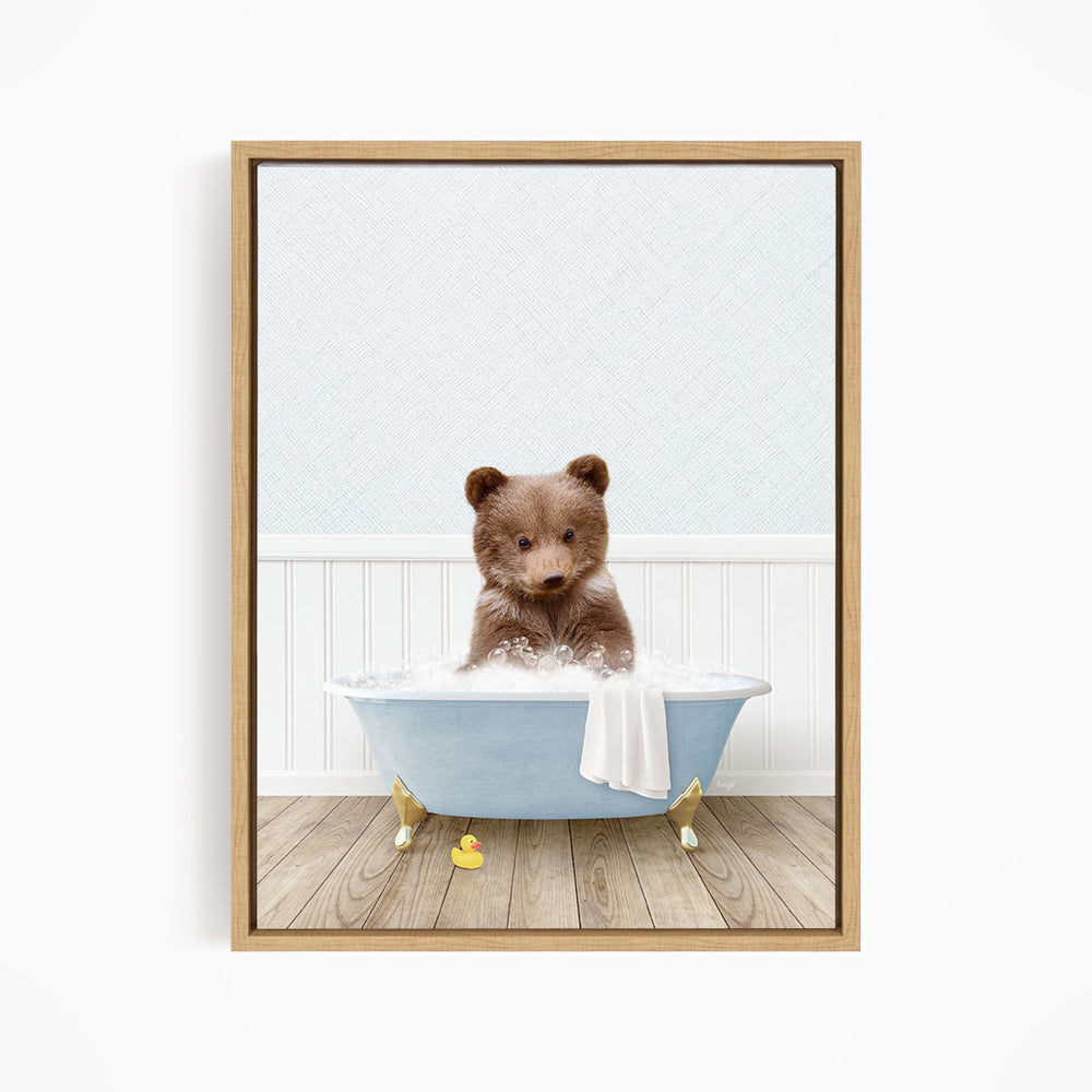 A brown bear sitting in a blue bathtub filled with water, surrounded by rubber ducks.