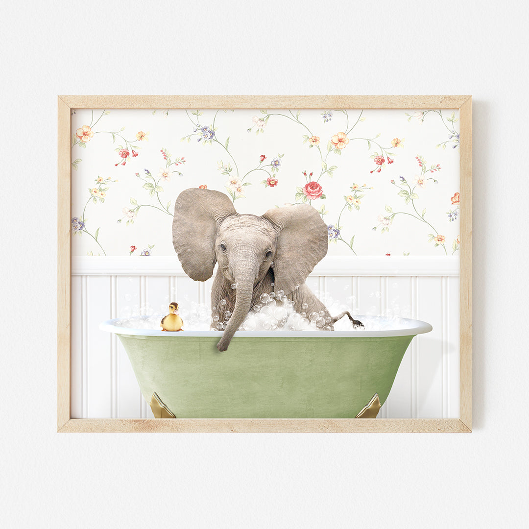 an elephant taking a bath in a green bathtub