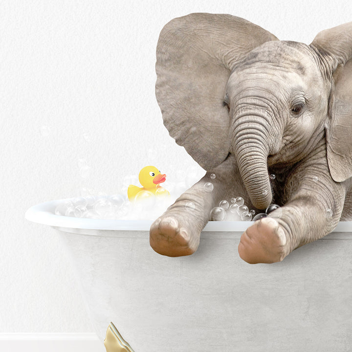 a baby elephant taking a bath in a bathtub