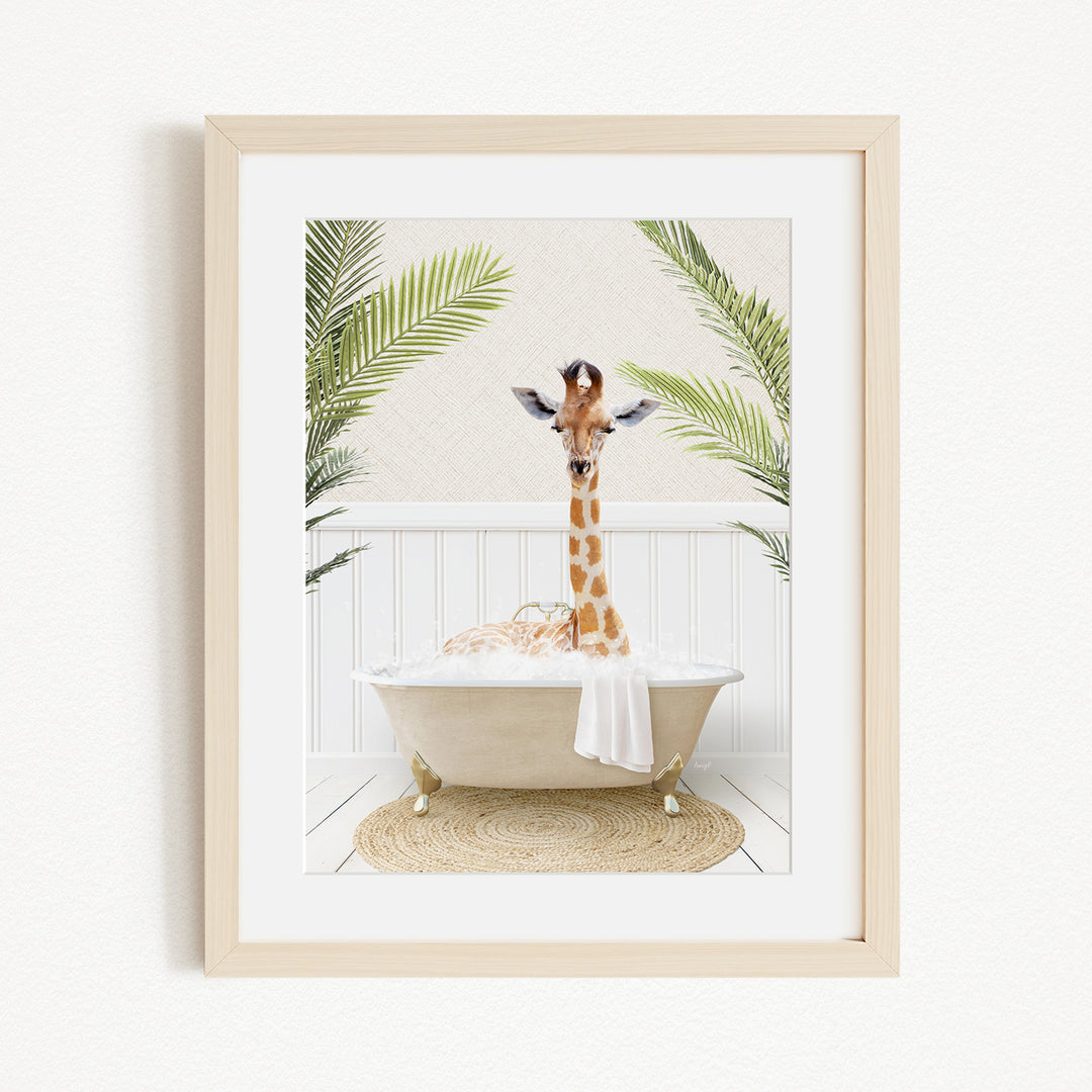 A giraffe is sitting in a bathtub filled with bubbles, surrounded by palm leaves, creating a whimsical and playful scene.