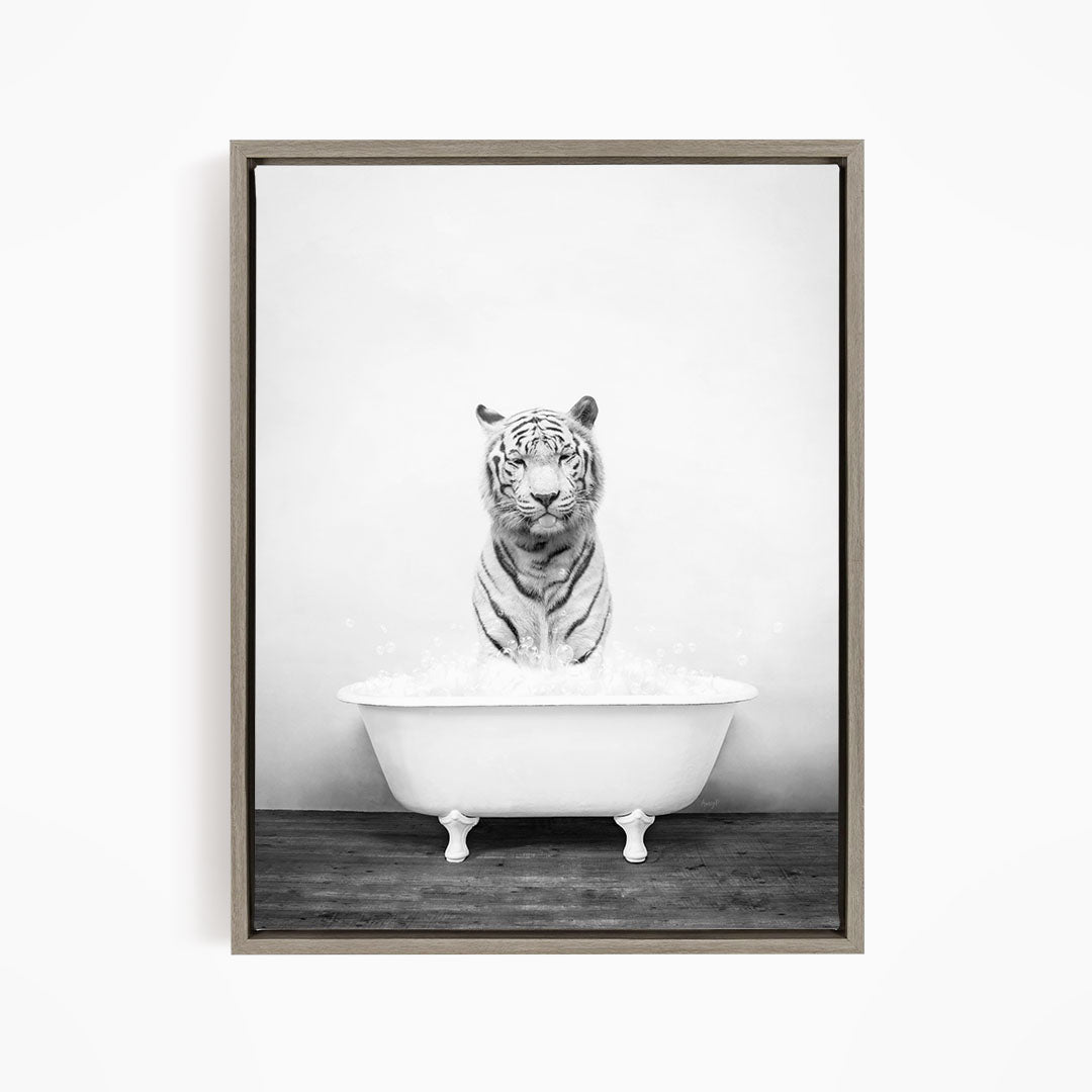 A black and white photograph of a tiger sitting in a bathtub filled with water.