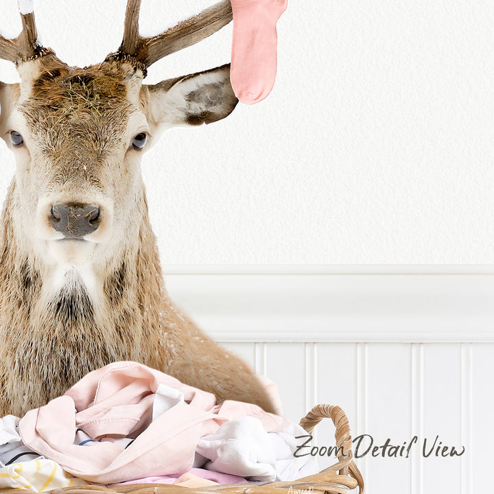 A deer head is shown in the image, with a pink sock hanging from its ear.