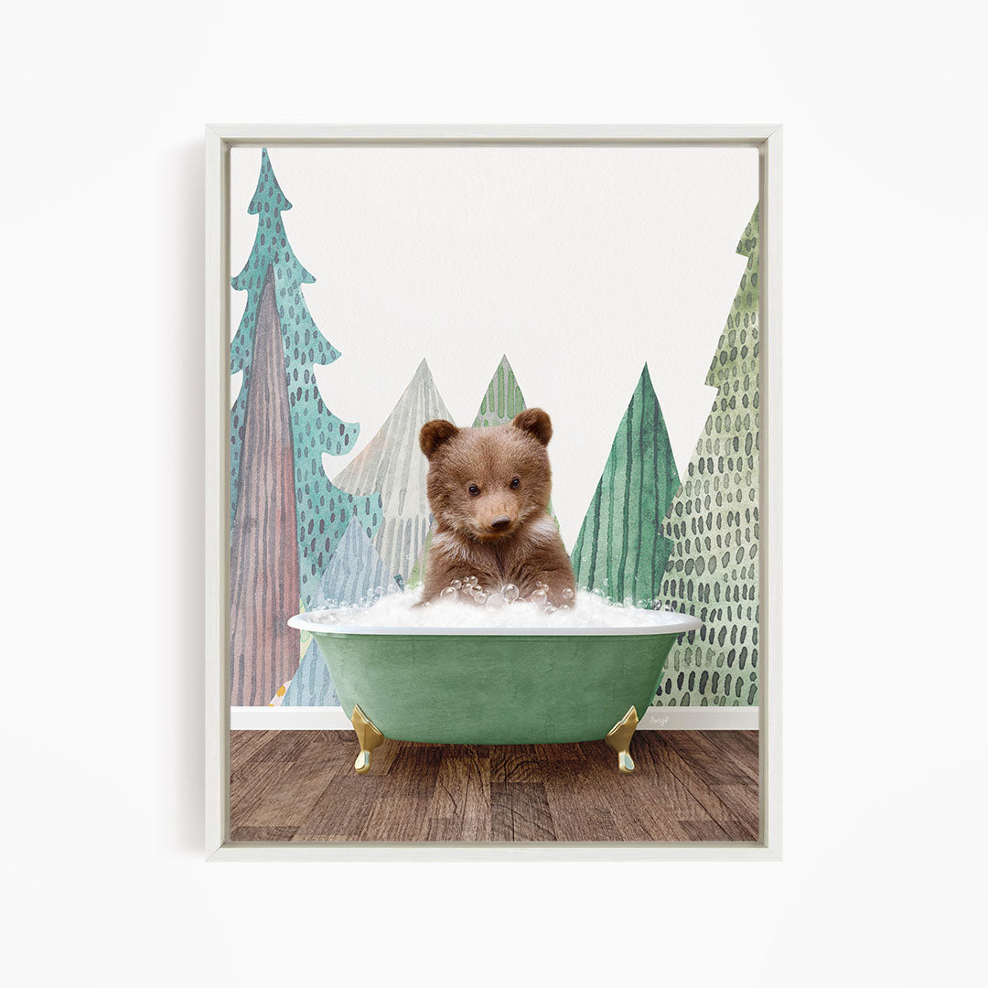 A brown bear sitting in a green bathtub, surrounded by a forest scene with trees and a snowy landscape.
