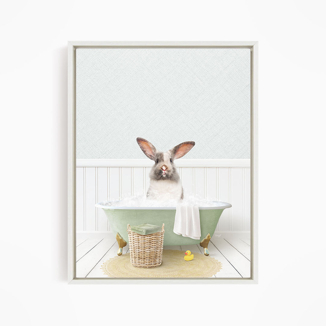 A white rabbit sitting in a green bathtub filled with water, surrounded by a yellow rubber duck and a wicker basket.