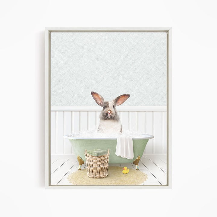 A white rabbit sitting in a green bathtub filled with water, surrounded by a yellow rubber duck and a wicker basket.