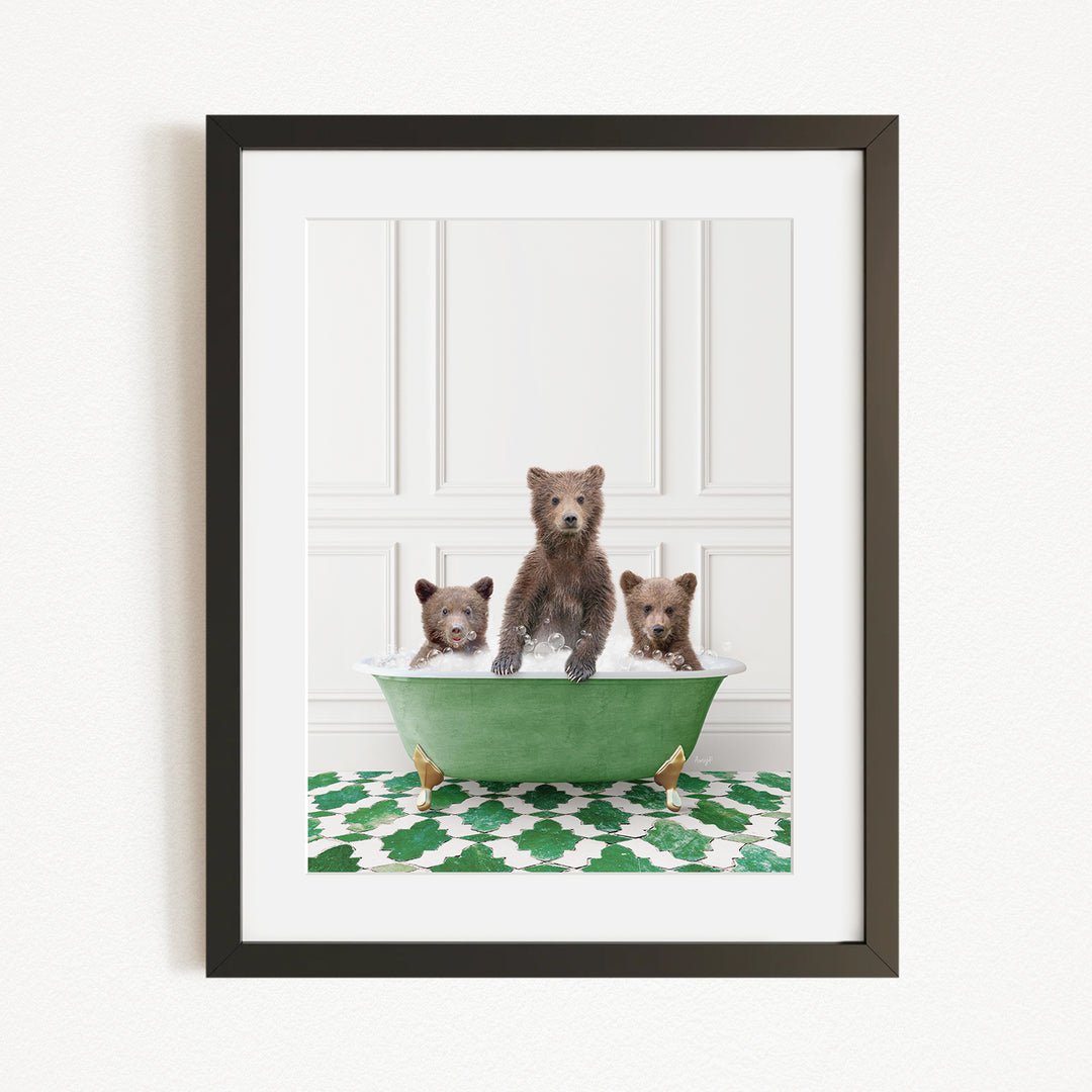 A framed image depicting three bears sitting in a green bathtub filled with bubbles.