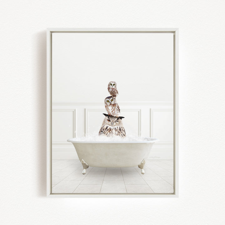 A white bathtub filled with water, with three owls perched on top of it.