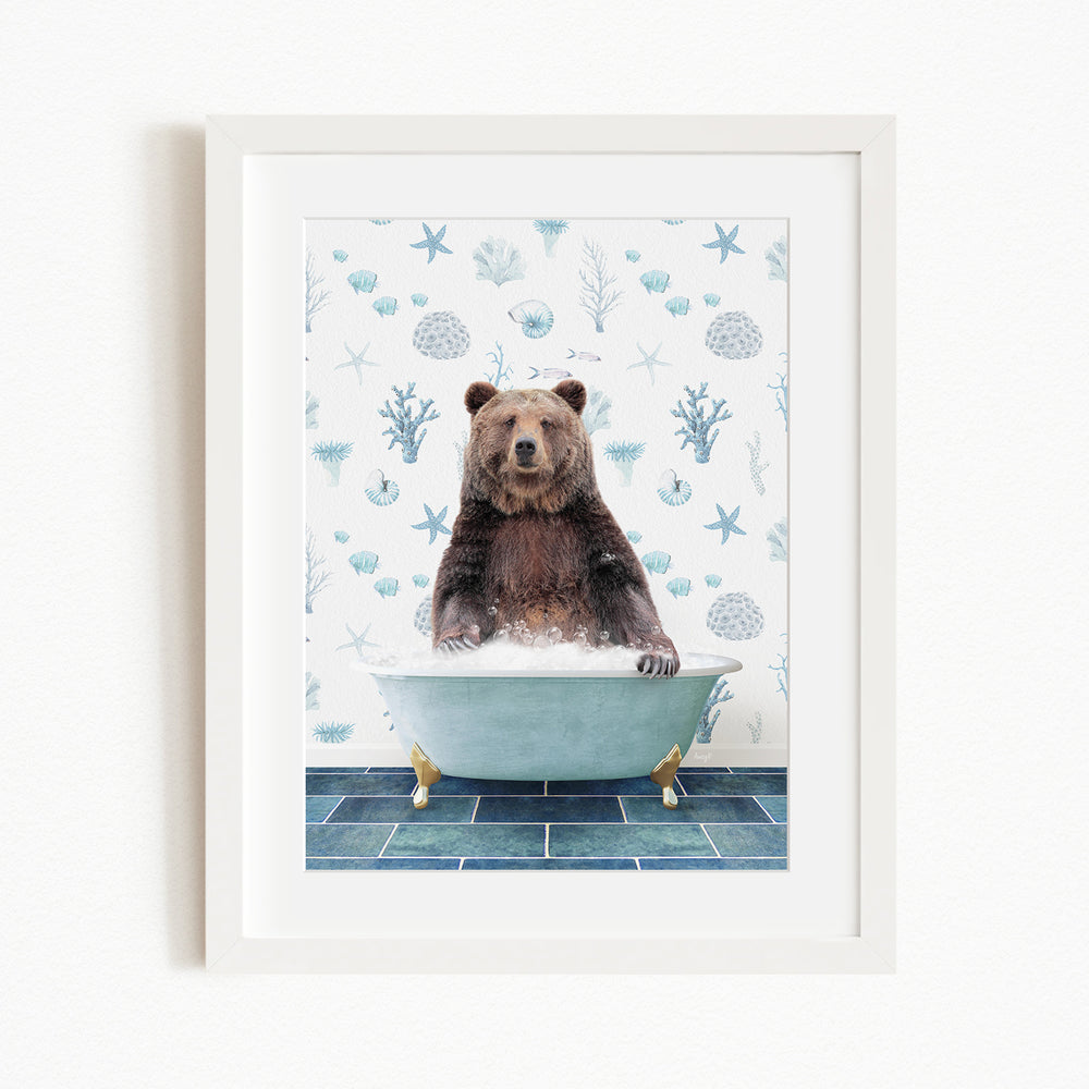 A brown bear sitting in a bathtub filled with water, surrounded by a pattern of blue and white seashells and starfish.