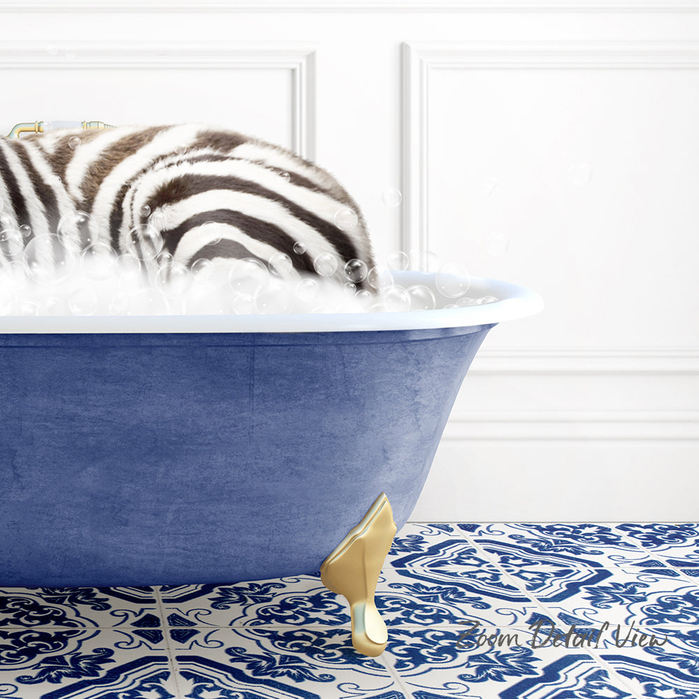 A zebra standing in a blue bathtub filled with bubbles, with a patterned tile floor in the background.
