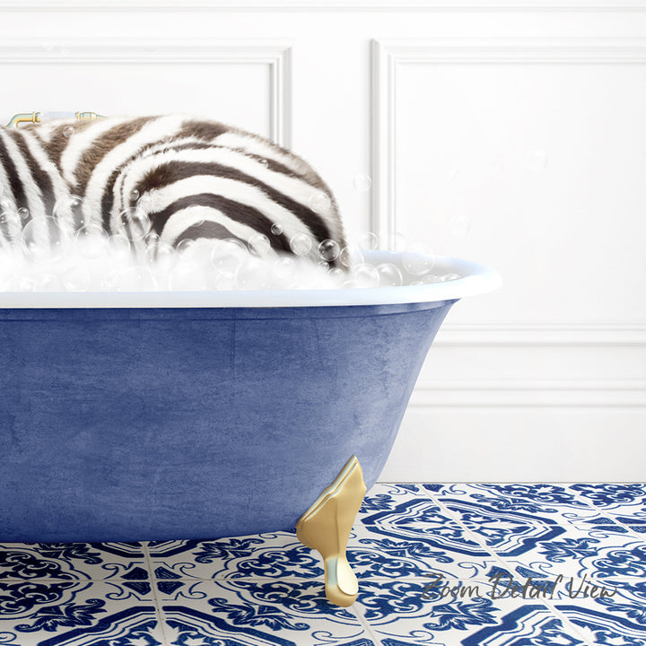 A zebra standing in a blue bathtub filled with bubbles, with a patterned tile floor in the background.