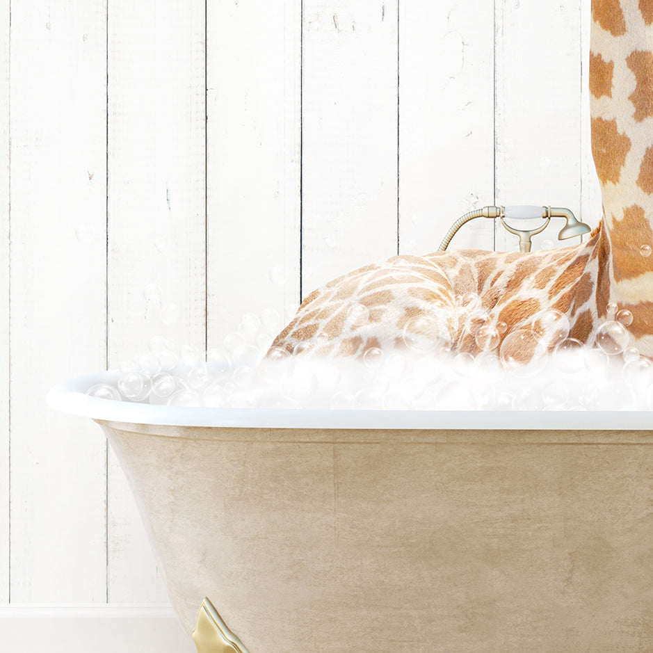 a giraffe laying down in a bath tub