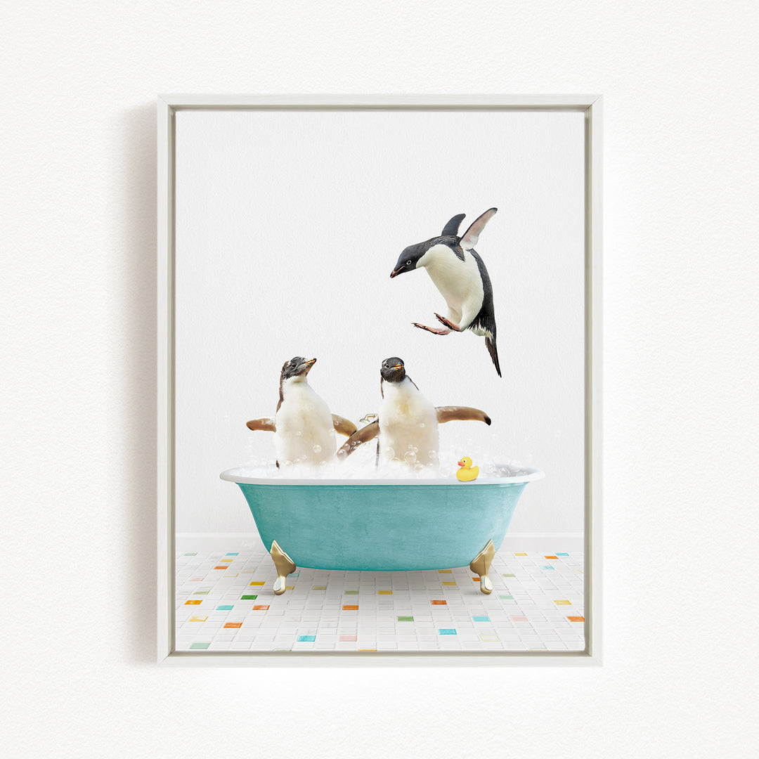 A framed image depicting two penguins sitting in a bathtub, with one penguin jumping out of the tub and another penguin sitting in the tub.