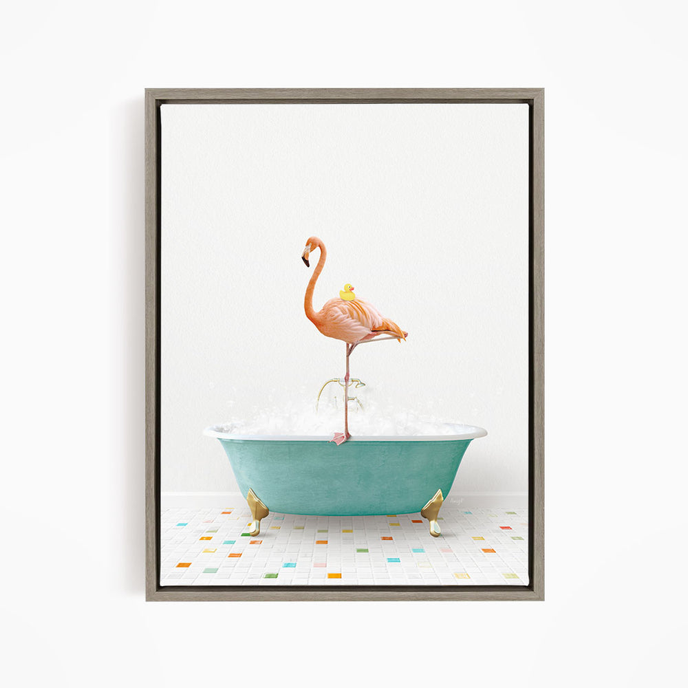 A flamingo standing on a blue bathtub filled with bubbles, with a yellow duck sitting on its back.
