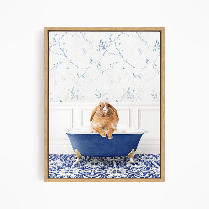 A brown rabbit sitting in a blue bathtub filled with water, surrounded by a blue and white patterned rug on the floor.