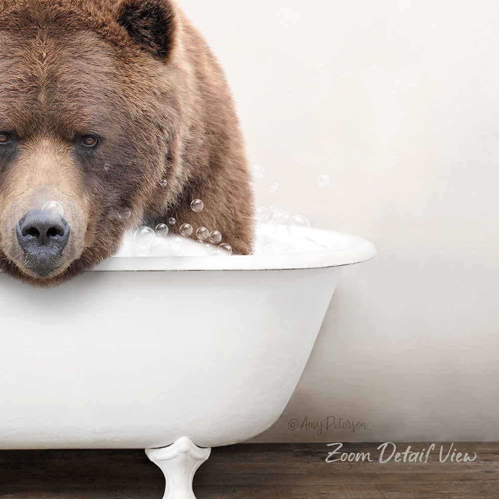 A brown bear is sitting in a white bathtub filled with water, surrounded by bubbles.
