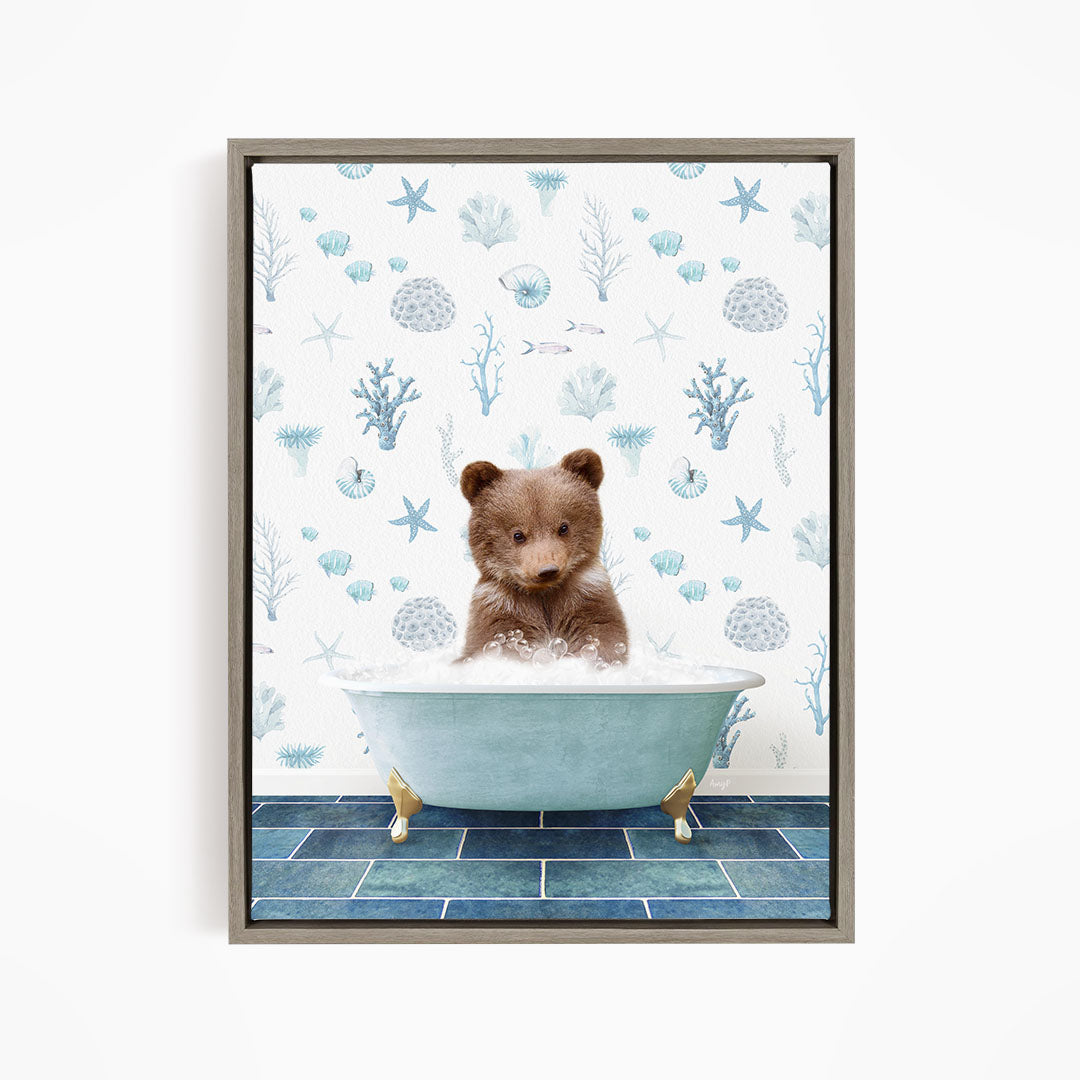 A cute brown bear sitting in a blue bathtub filled with bubbles, surrounded by a pattern of seashells, starfish, and other marine life.