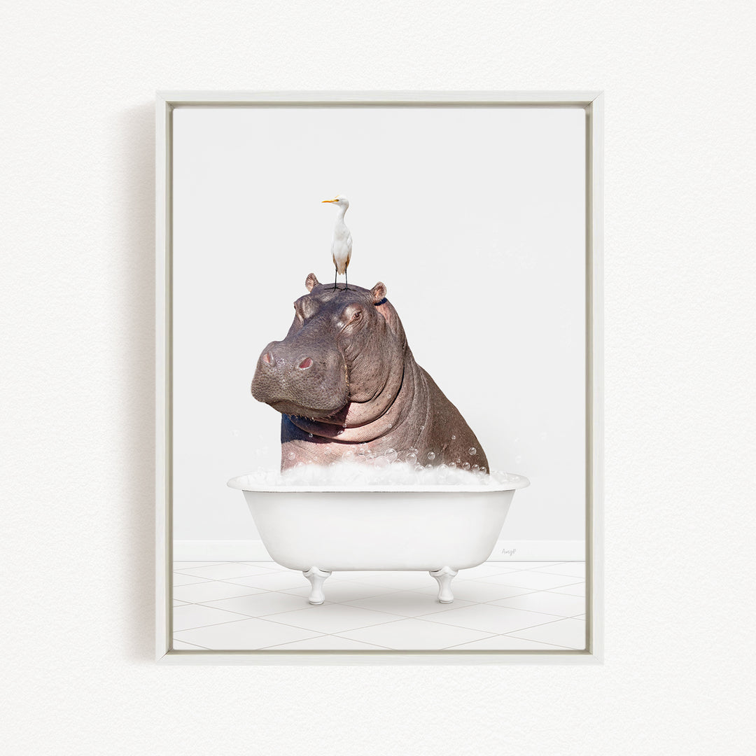 A large hippopotamus is sitting in a white bathtub, with a seagull perched on its head.