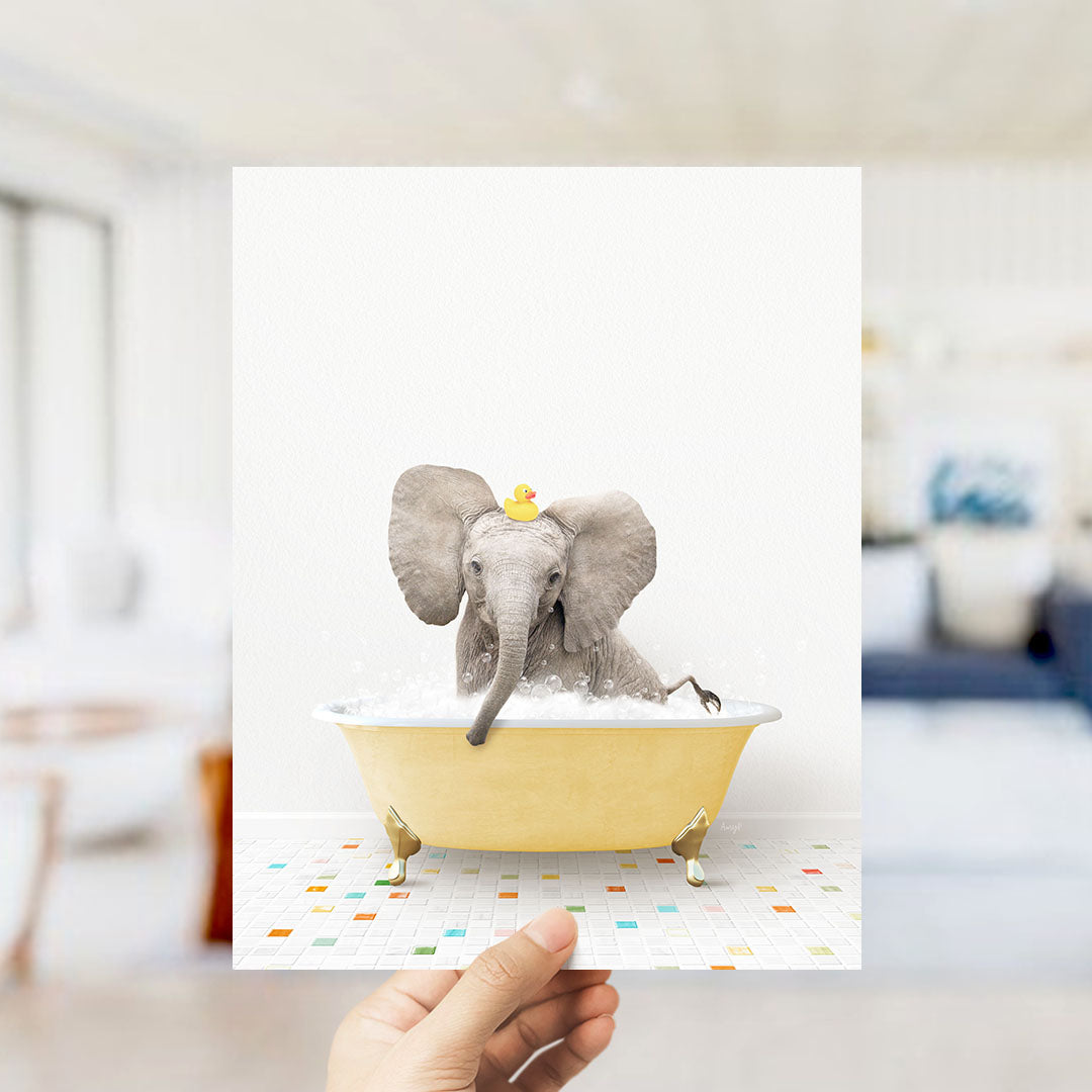A small elephant is sitting in a yellow bathtub filled with water, wearing a yellow rubber duck on its head.