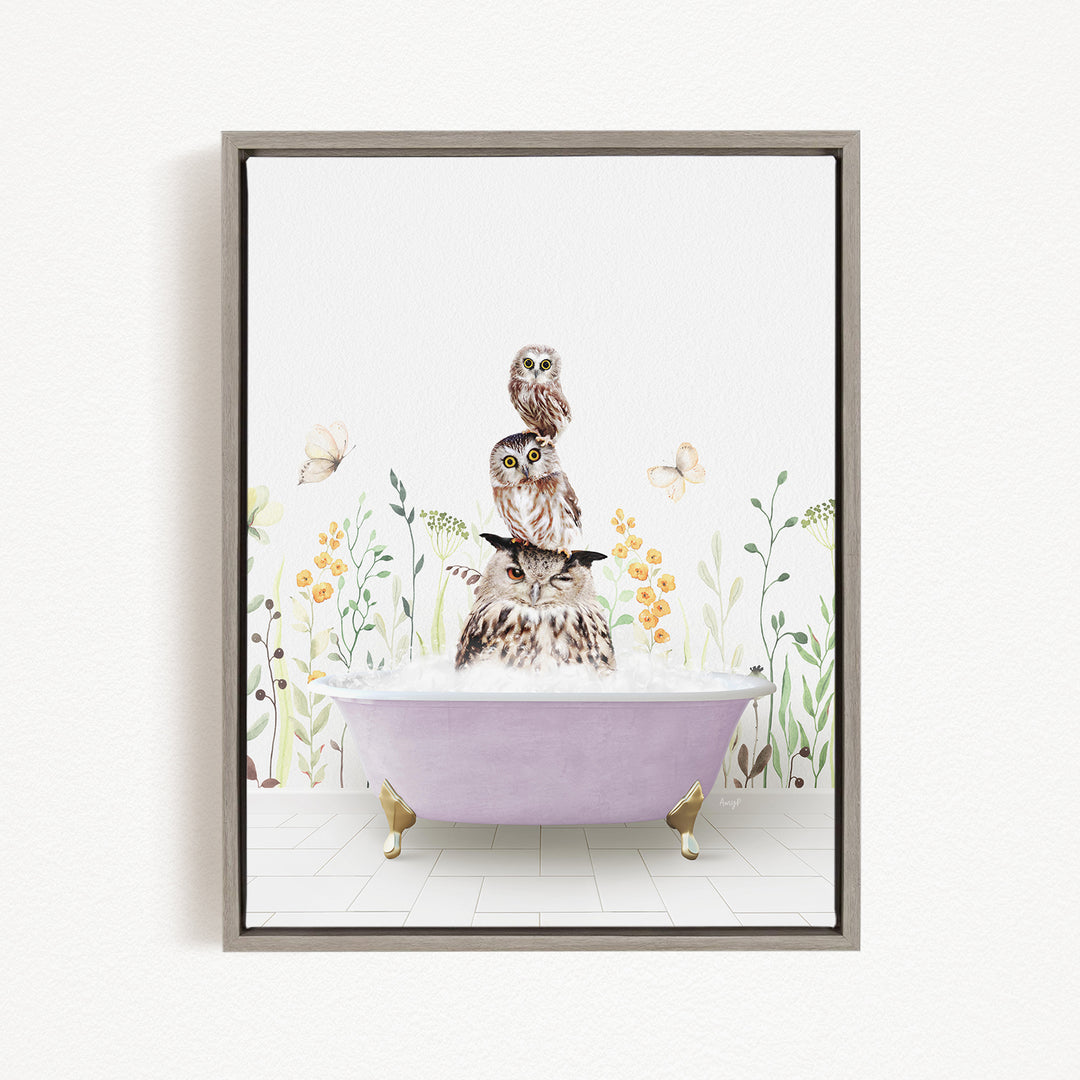 A framed illustration depicting three owls sitting in a bathtub filled with water, surrounded by flowers and butterflies.