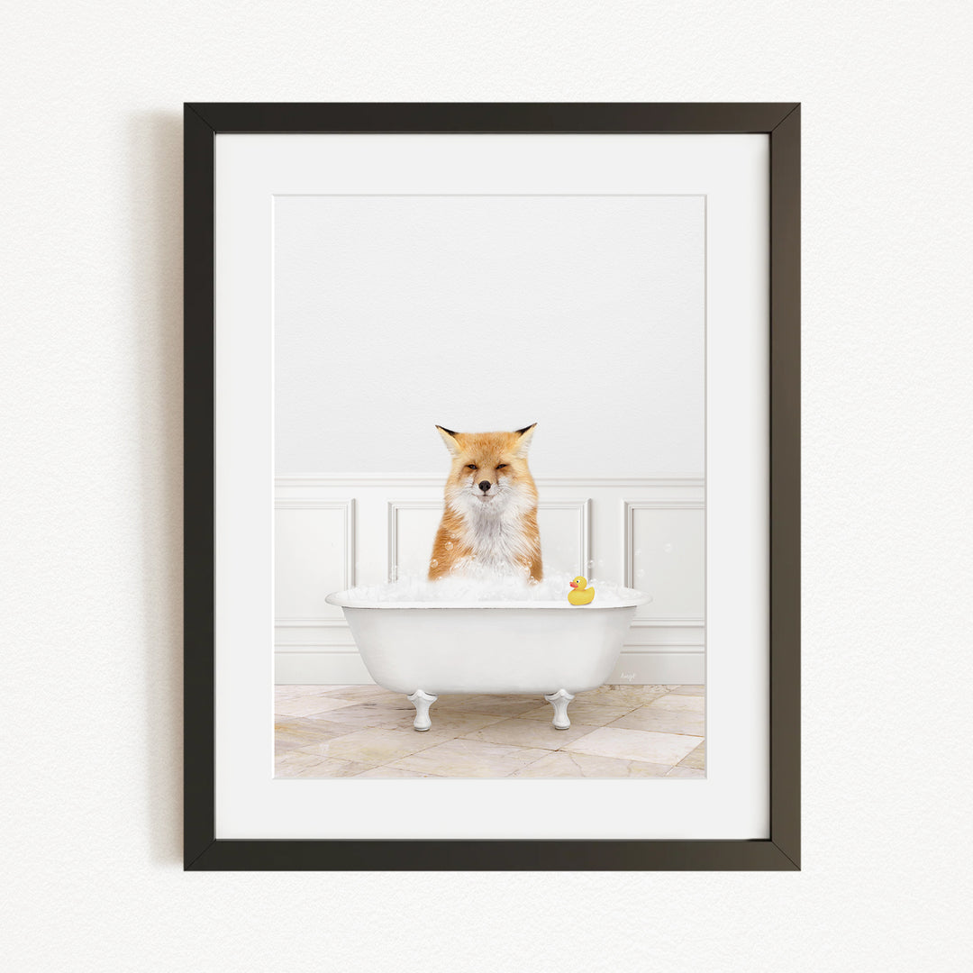A red fox is sitting in a white bathtub filled with water, with a yellow rubber duck floating in the water.