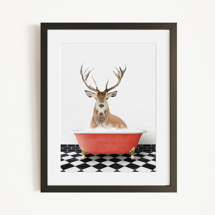 A deer with large antlers is sitting in a red bathtub, surrounded by a black and white checkered floor.