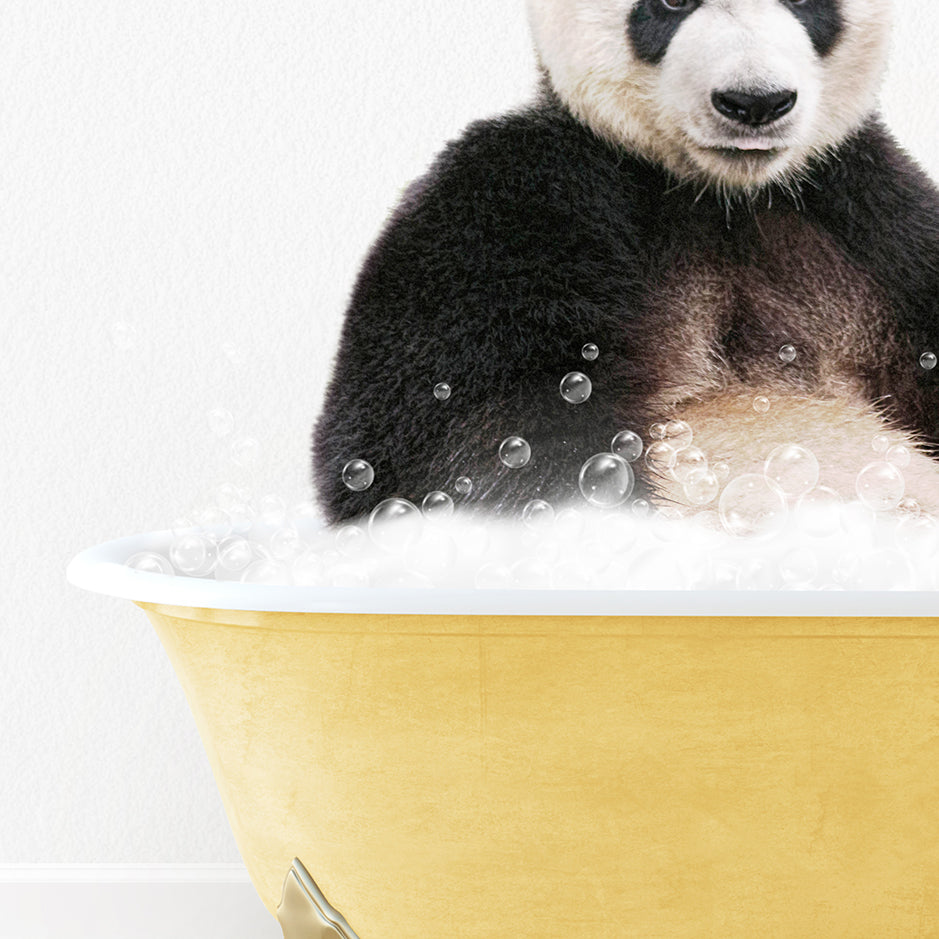 a panda bear sitting in a bathtub full of bubbles