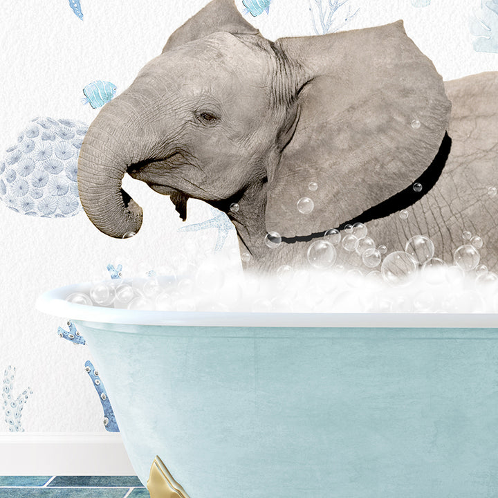 a baby elephant taking a bath in a bathtub