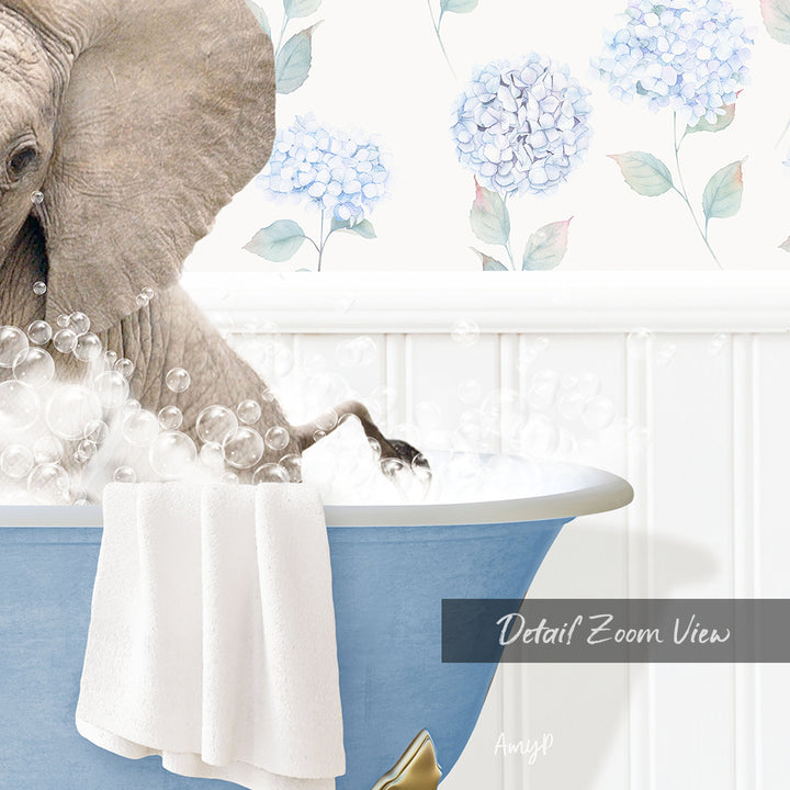 A large elephant is taking a bath in a blue bathtub, surrounded by bubbles and a towel.