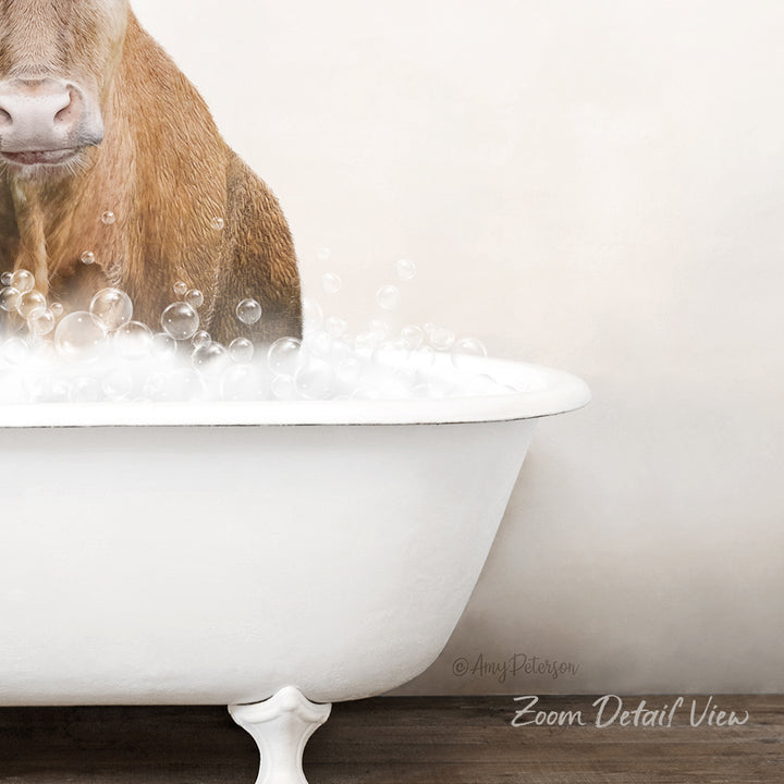 A brown cow is sitting in a white bathtub filled with bubbles, creating a whimsical and playful scene.