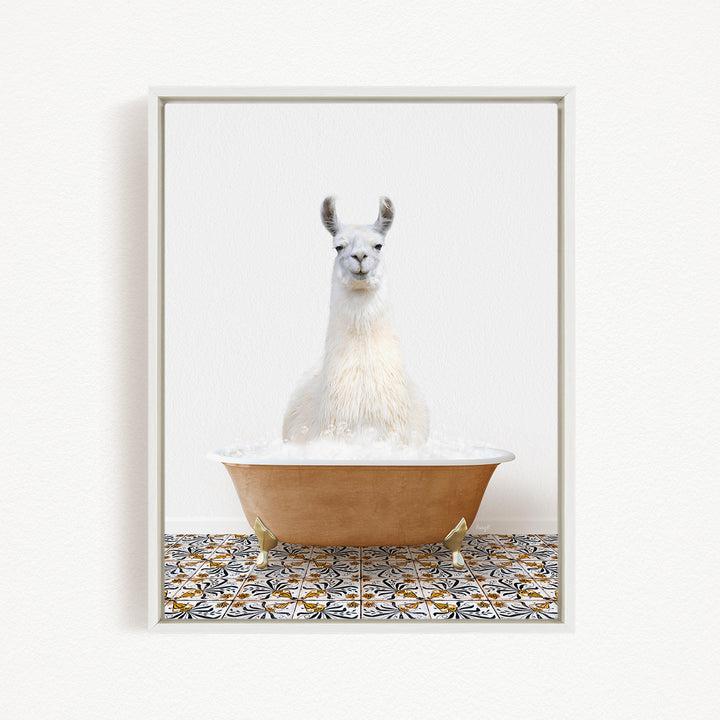 A white llama sitting in a bathtub filled with bubbles, surrounded by a patterned tile floor.