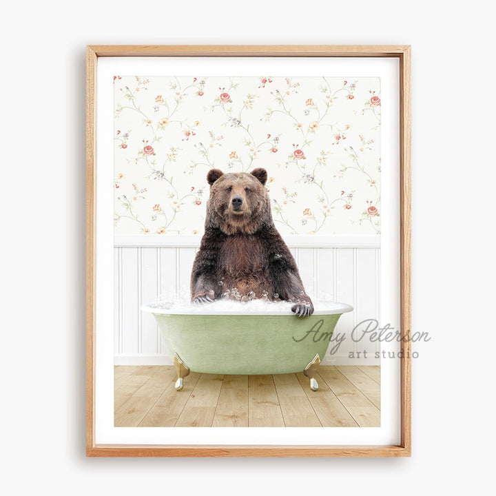 a brown bear sitting in a green bath tub