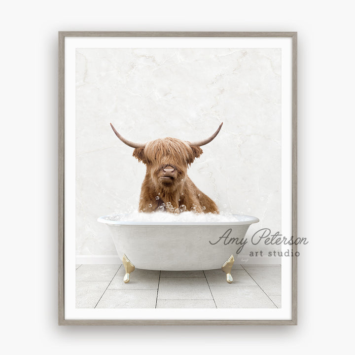 a brown dog sitting in a bathtub with long horns