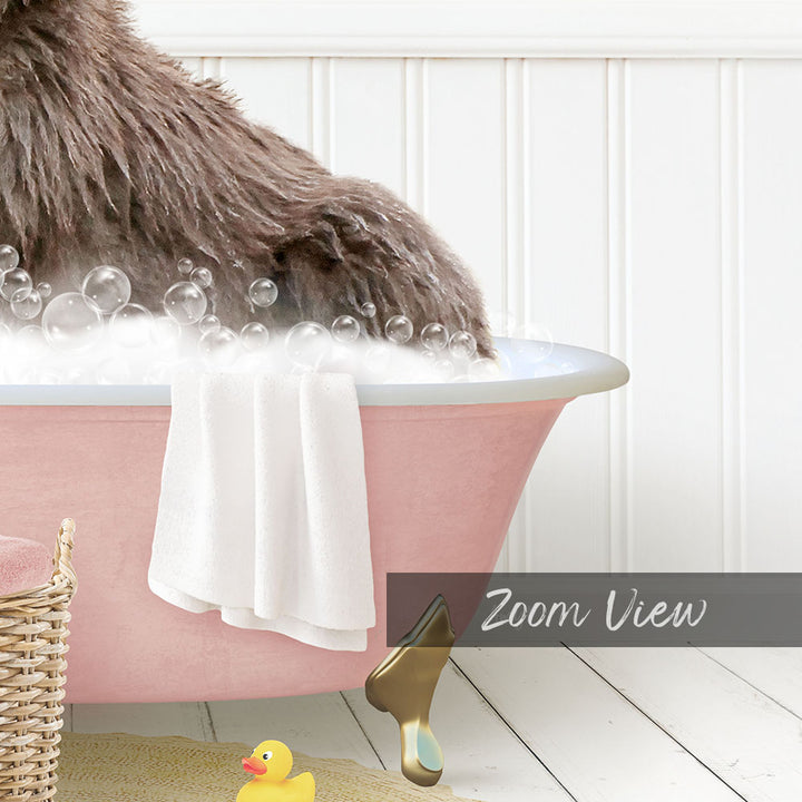 A fluffy brown dog is sitting in a pink bathtub filled with bubbles, surrounded by a yellow rubber duck and a white towel.