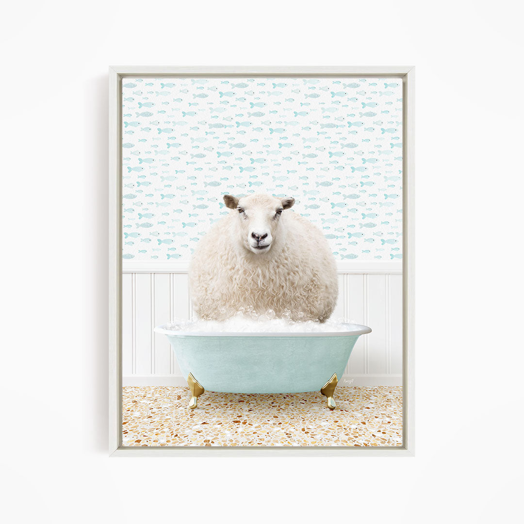 A fluffy white sheep sits in a light blue bathtub, surrounded by a pattern of small fish.