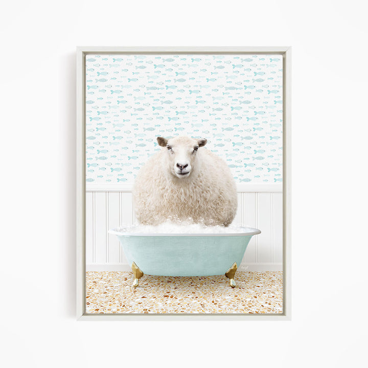 A fluffy white sheep sits in a light blue bathtub, surrounded by a pattern of small fish.